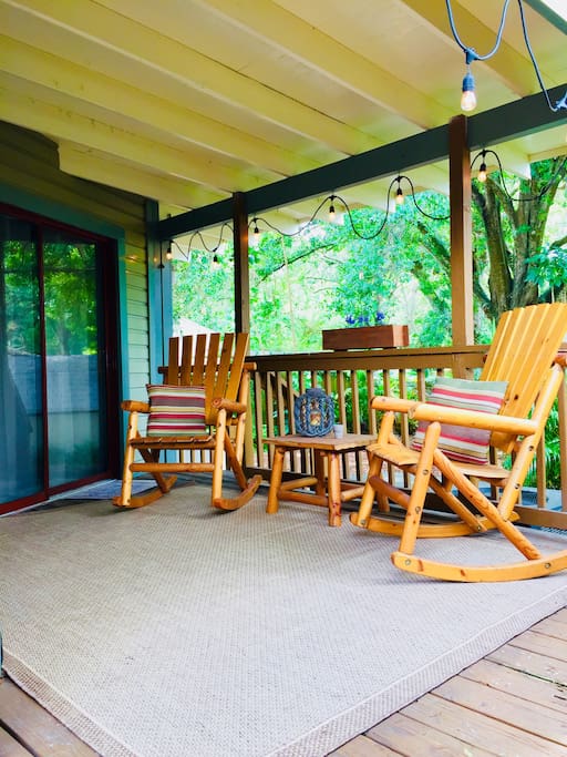 Enjoy casual conversation or the year-round warmth of Tampa here in these cedar rockers just outside your guest villa!
