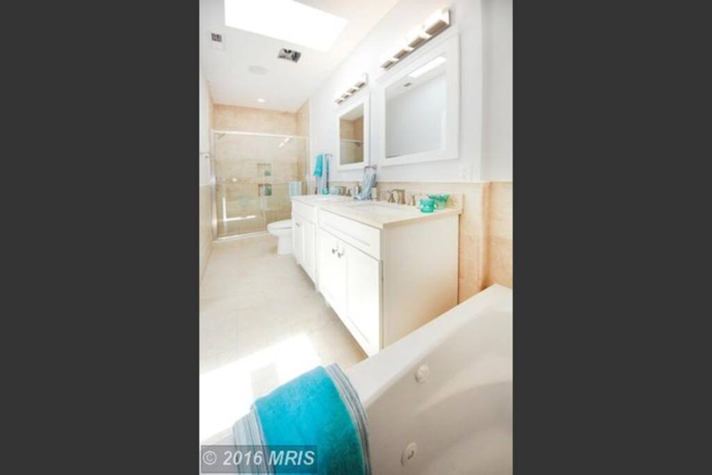 Relax after a long day in the private Master Bathroom jet pool tub or spa stone shower