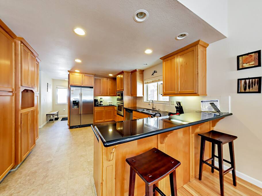 Sip morning coffee at the breakfast bar with seating for 2.