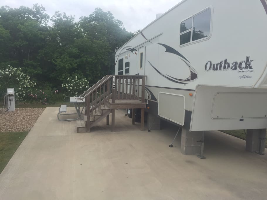 Typical 5th Wheel Travel Trailer on concrete pad with steps!