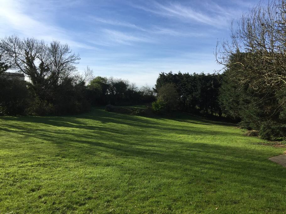 View from the caravan. All this space to play, park, barbecue, walk the dog......