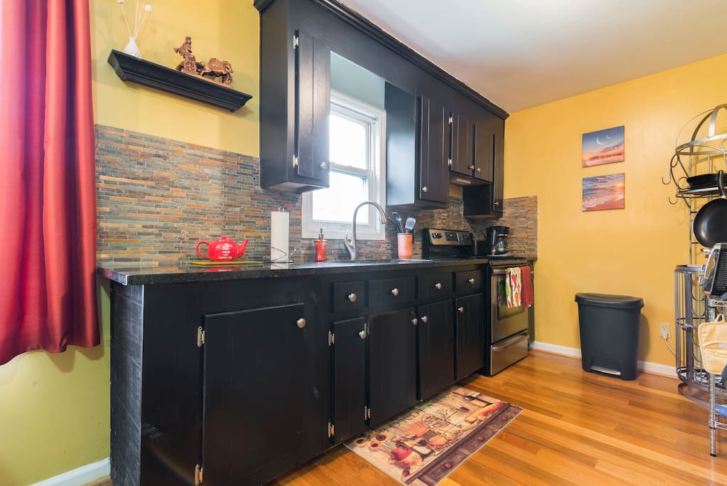 Exquisite kitchen with black granite and stainless steel appliances.