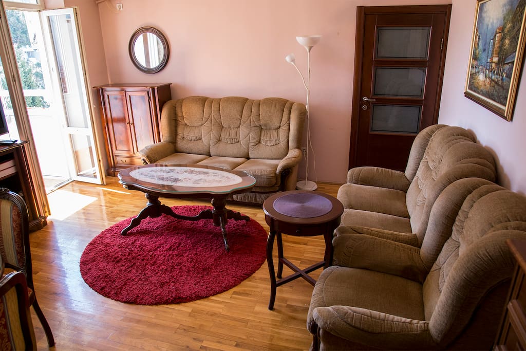 Sunny living rooms with the balcony on the left.