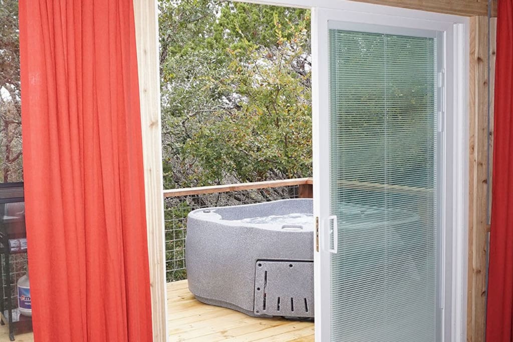 Darling new cabin with peek-a-boo views of the river through the woods and a romantic hot tub for too off the bedroom.