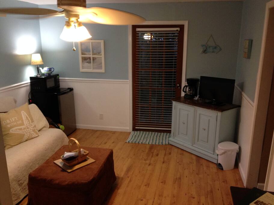 TV, coffee maker, fridge and microwave are provided.