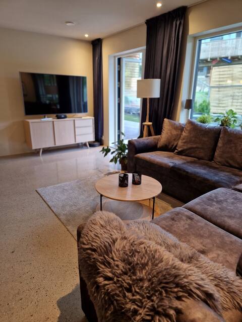 Newer single-family home near the sea and the city.