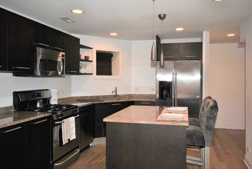 Kitchen with center island dining area.