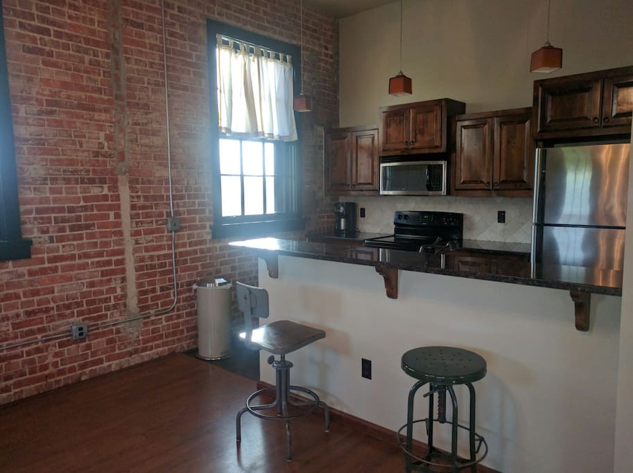 Full kitchen with dishwasher.