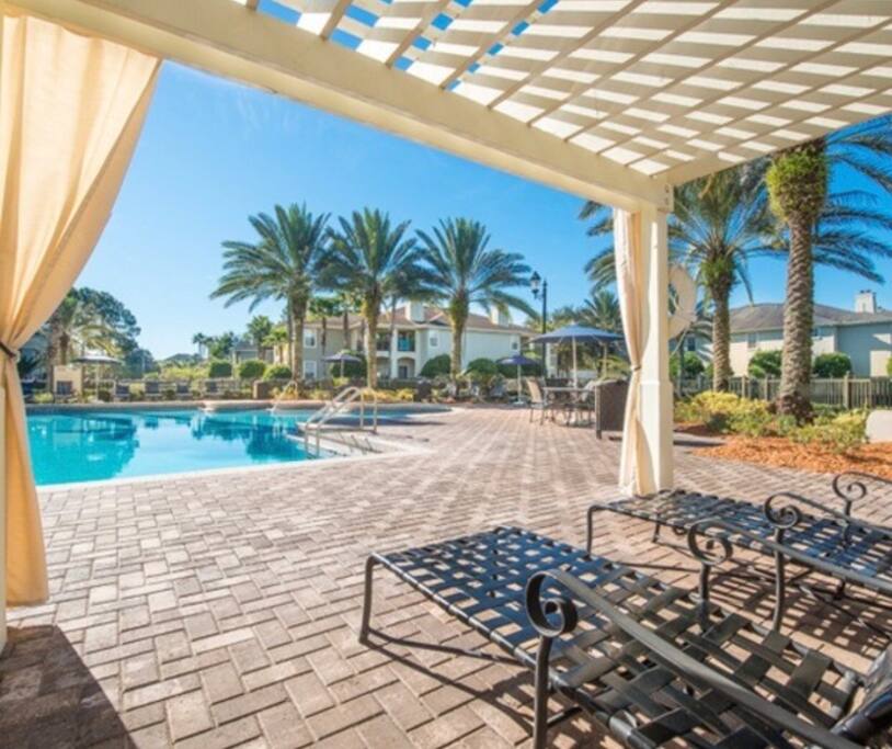 Pool side chairs right next to the apartment