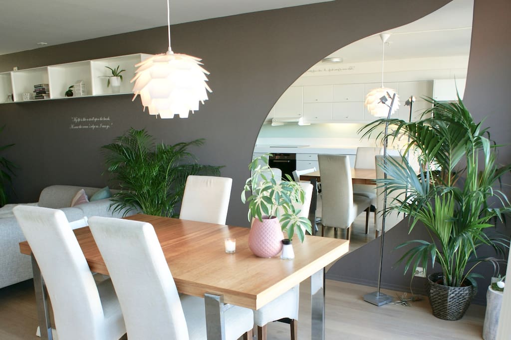 Close up on living room table for enjoying healthy meals with stunning fjord view.
With apple leaf mirror in the background.