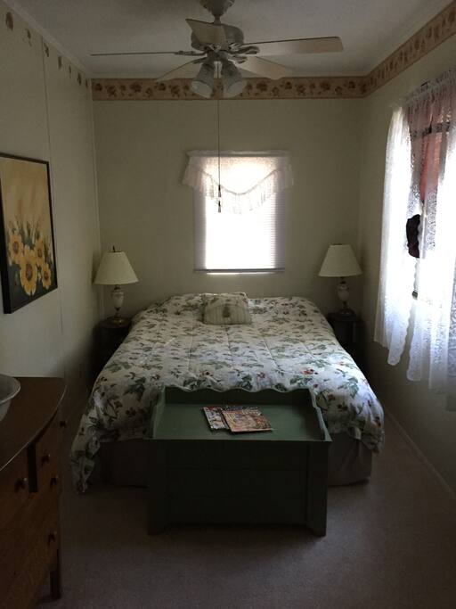 Queen bed with a private entrance and full bathroom, frig and microwave.