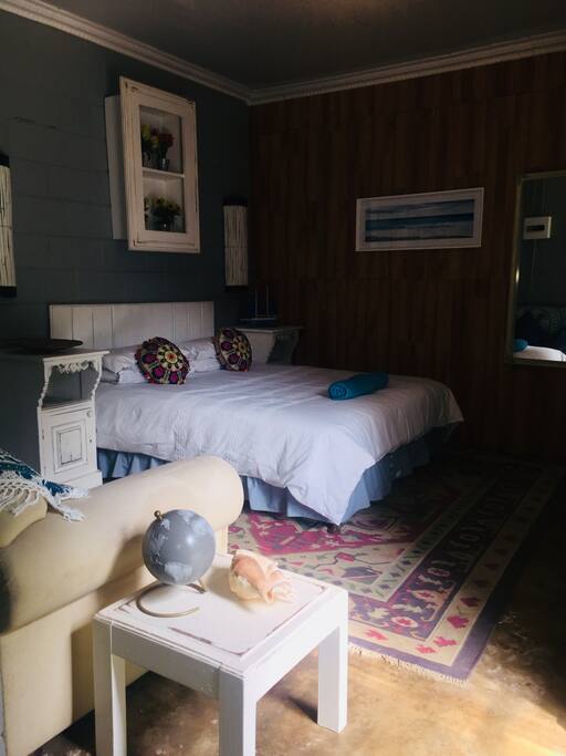 Queen size double bed with cotton linen and down duvet.