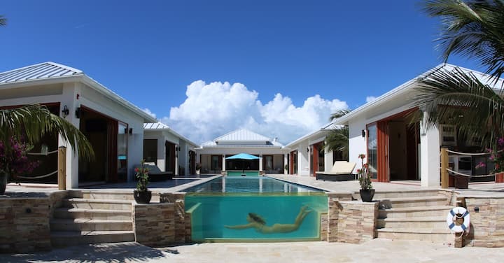 View of the pool and guest suites from the Villa's private dock
