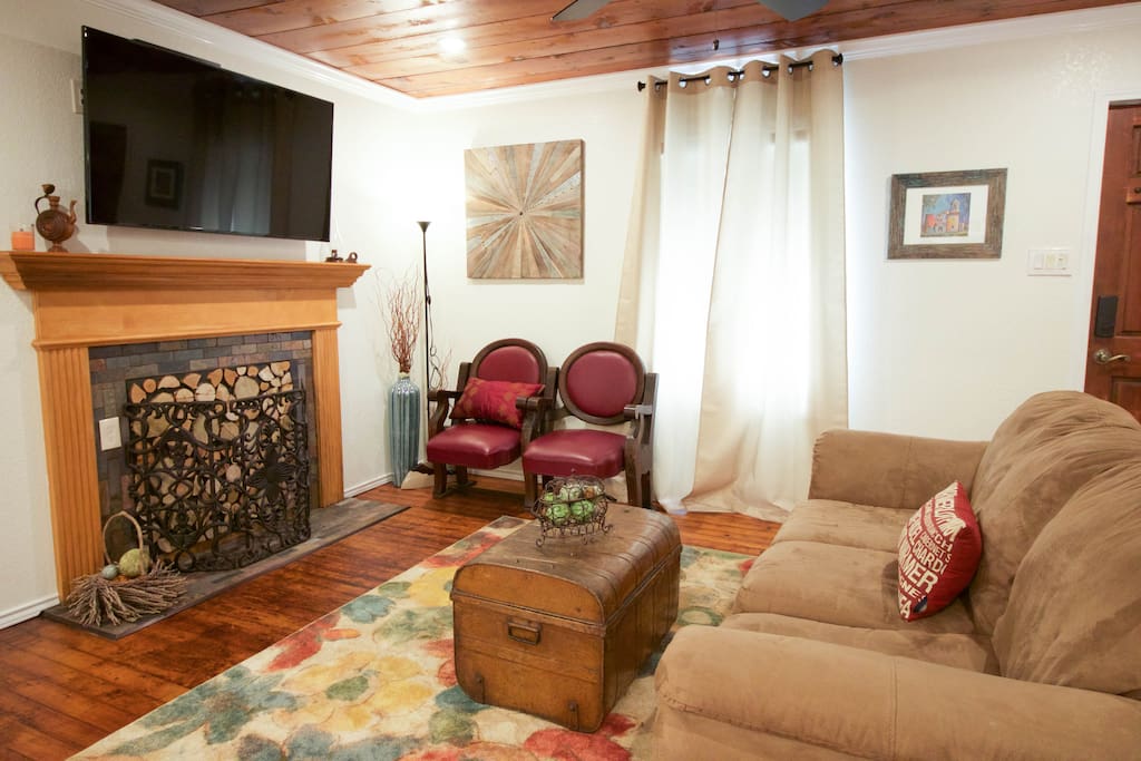 A cozy living room with a 55 inch flat screen to wind down after a long day.