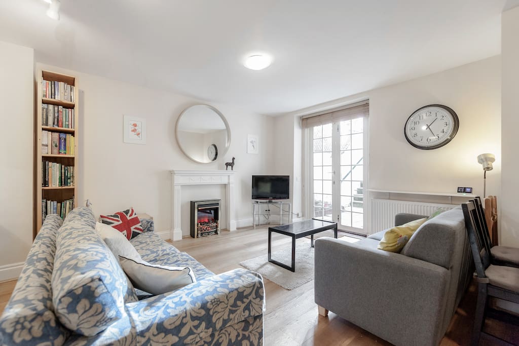 Open plan living room with electric fire, great for cozy evenings.