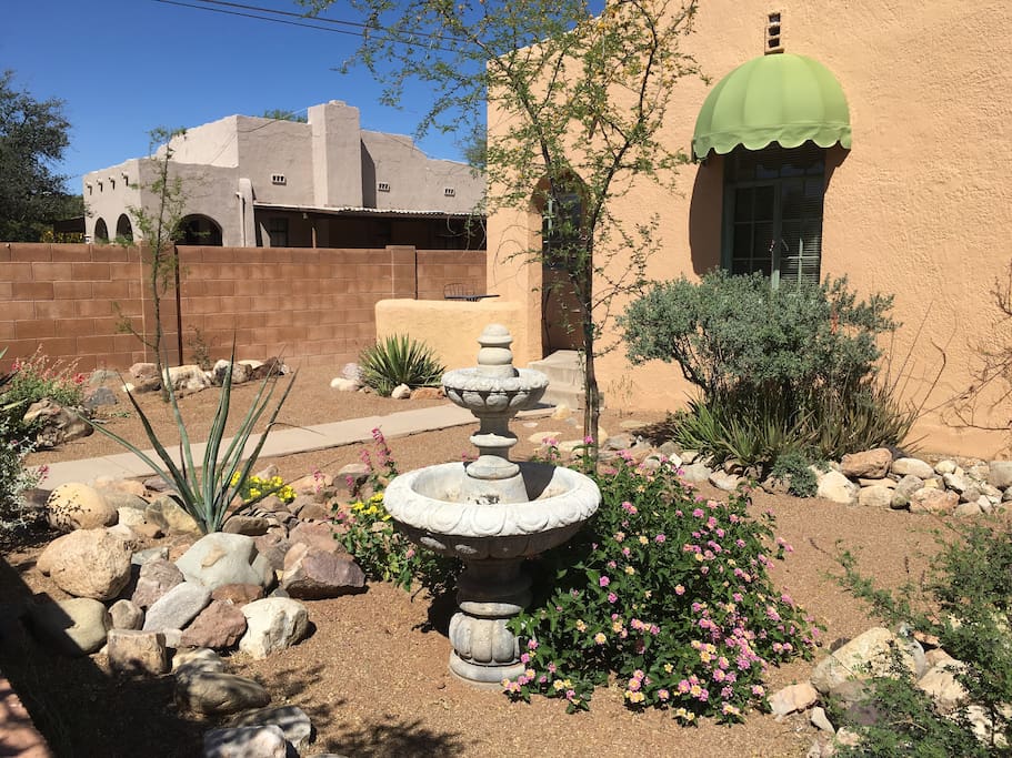 Front yard with bright spring and summer flowers.