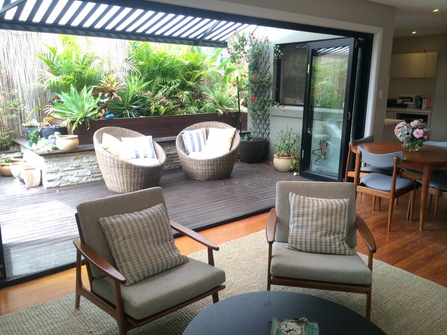 stripey awninc creates an outdoor room, come rain or shine.