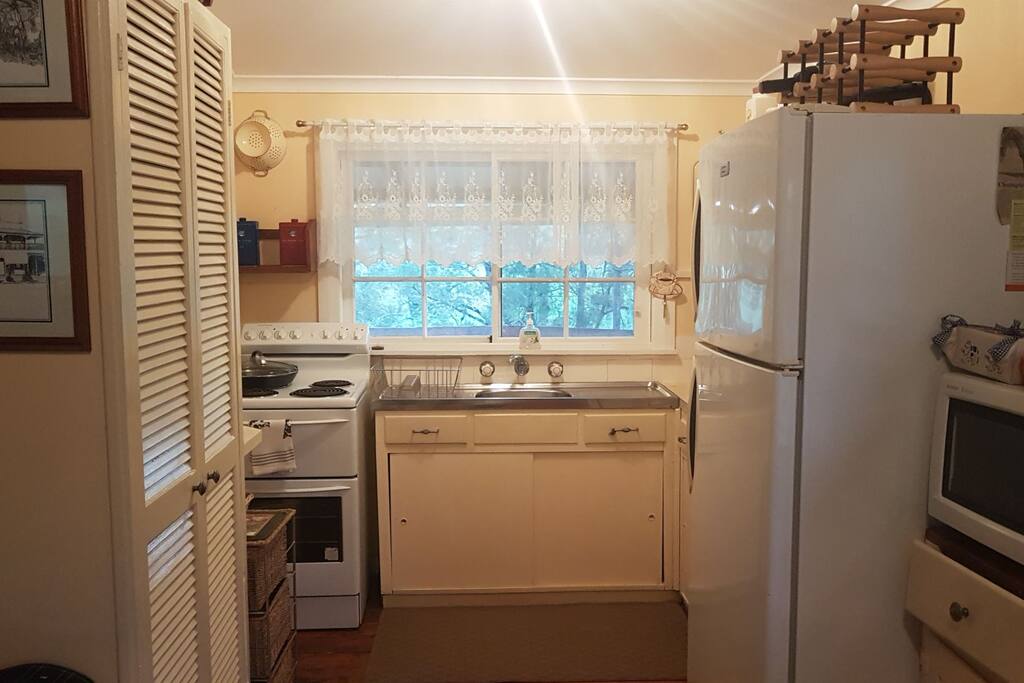 Well appointed kitchen with electric stove micro wave large fridge freezer. plenty of cooking utensils, crockery etc. The pantry is stocked with the basics.