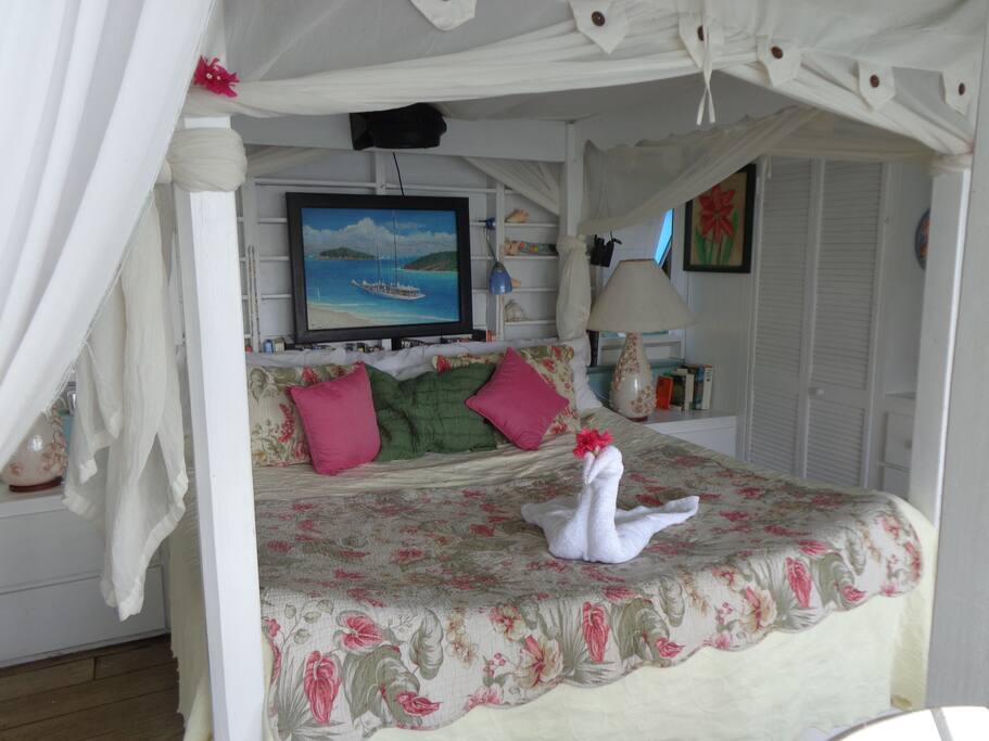 Here you see the curtained privacy, and the mosquito net together. The Lady Nelson also has a reading light and a fan.