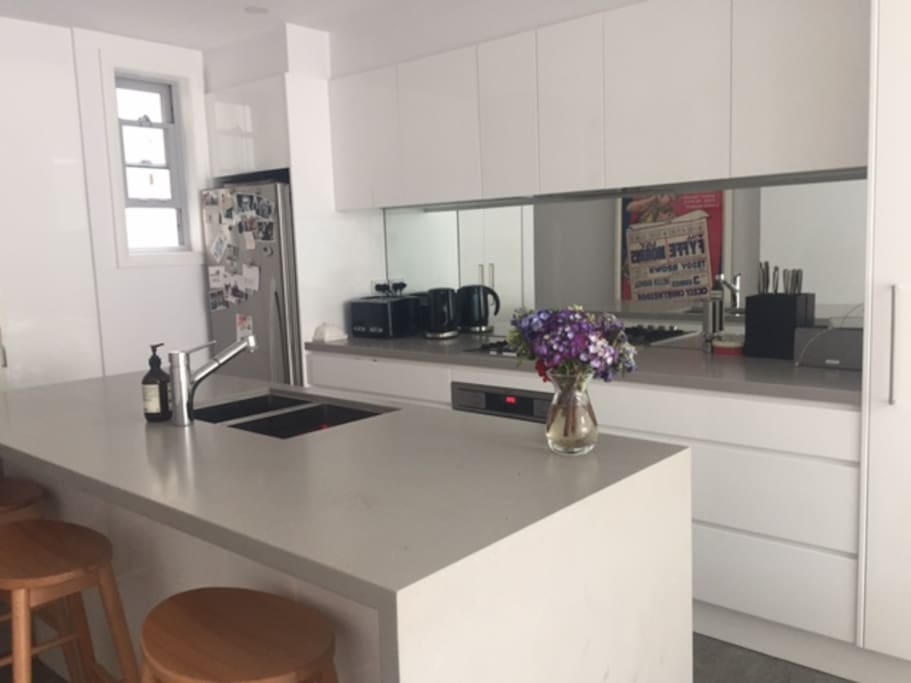 Fully equipped modern kitchen, with breakfast bar.