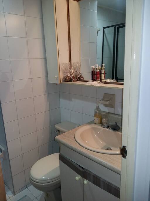 bathroom with shower next door