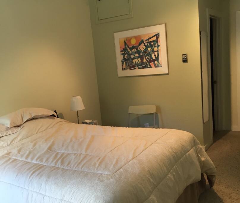 Upstairs bedroom with queen bed and bathroom