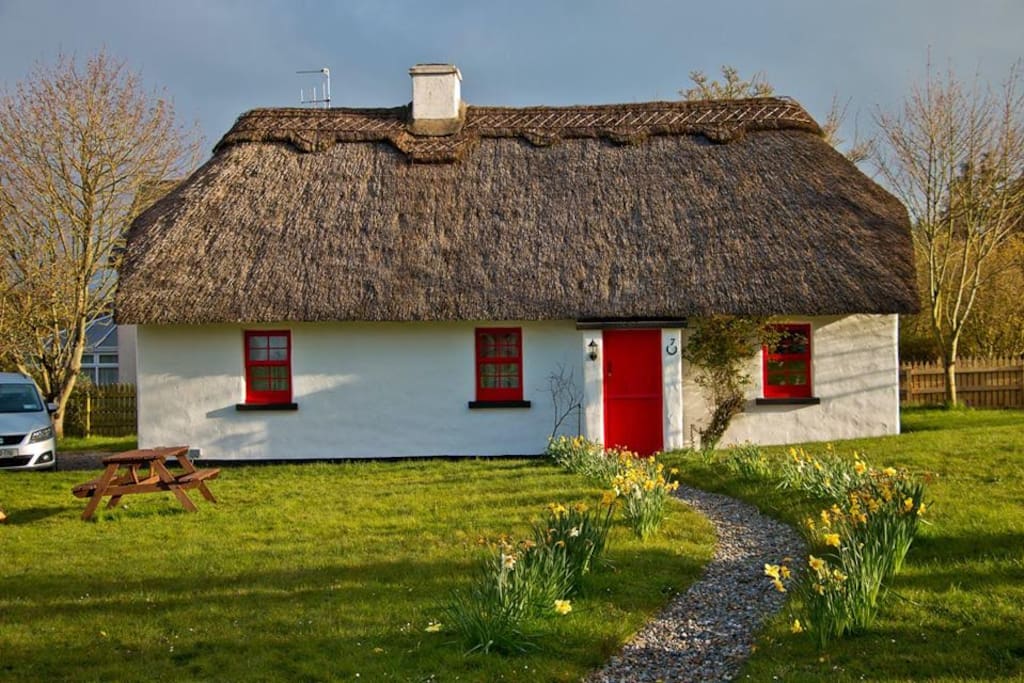 An external view of the cottage in spring