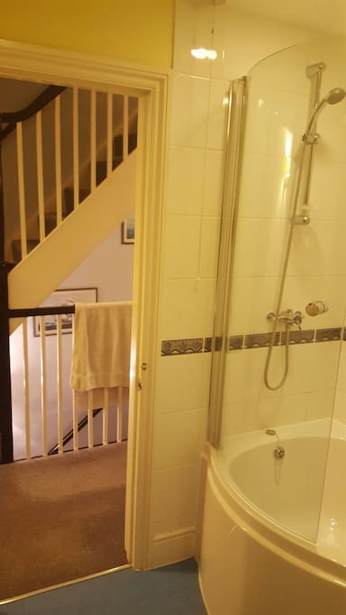Shower and the stairs behind.