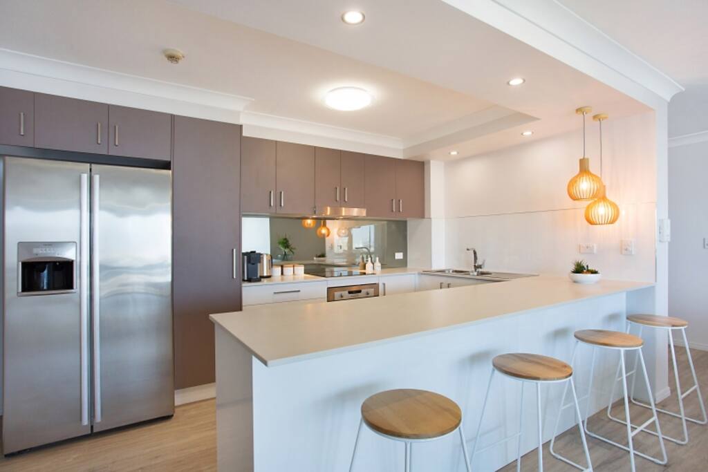 Spacious open plan kitchen where you can do as much or as little as you choose.