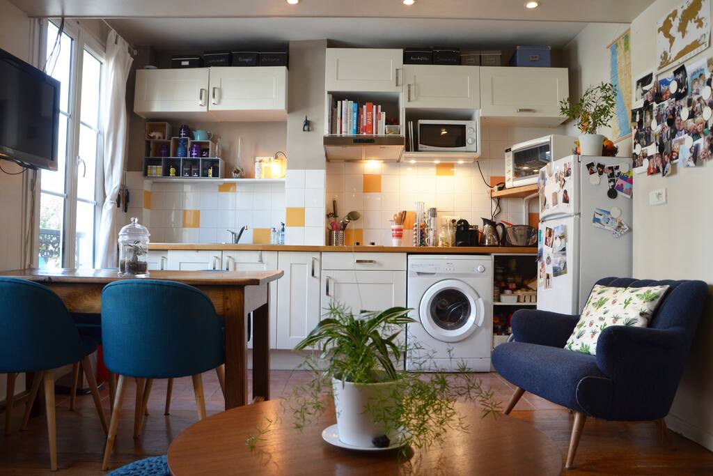 A large fully equipped open kitchen overlooks the living room