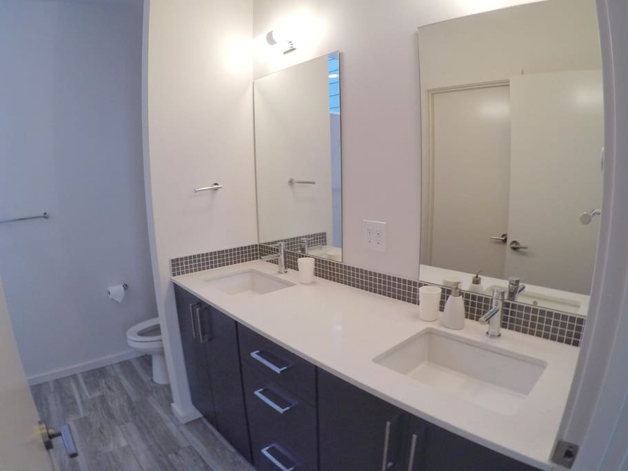 Luxurious double sink bathroom with heated floors
