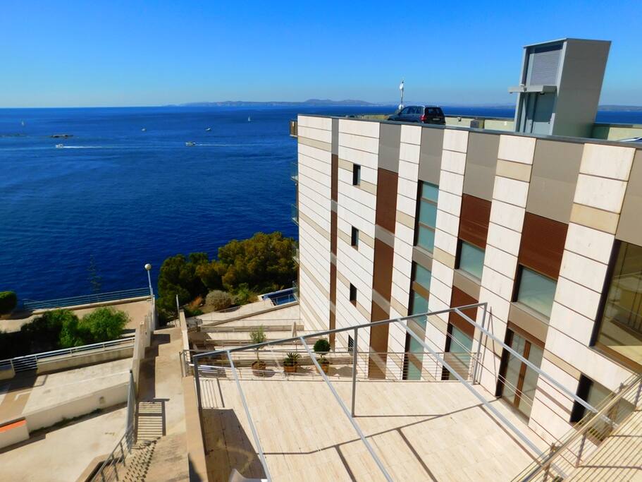 The modern building with private pool and personal parking.