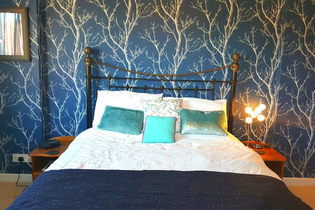 Your comfy, king size bed with fresh white linen.