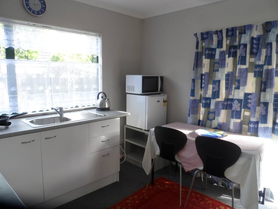 Self-Contained kitchen with small fridge