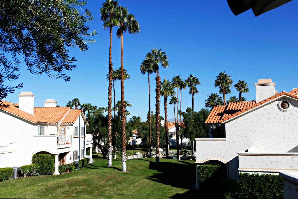 view from the spacious balcony to the pool and mountains.