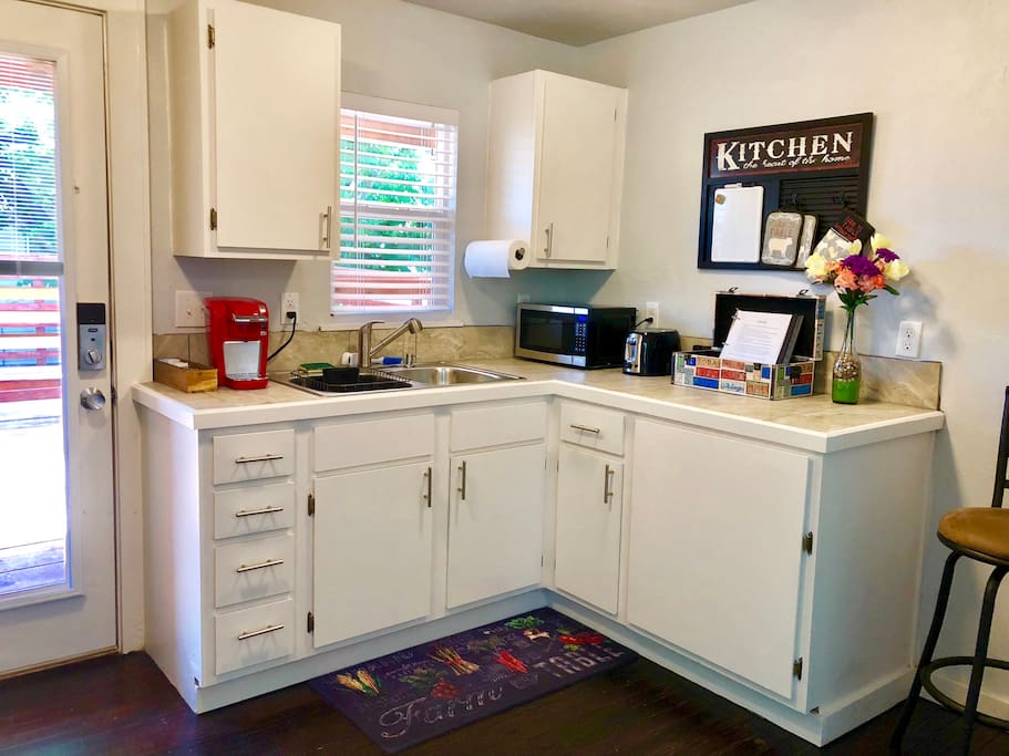 Fully equipped Kitchen with Coffee Maker, Microwave, Toaster, Refrigerator, Stove/Oven, & Kitchenware.