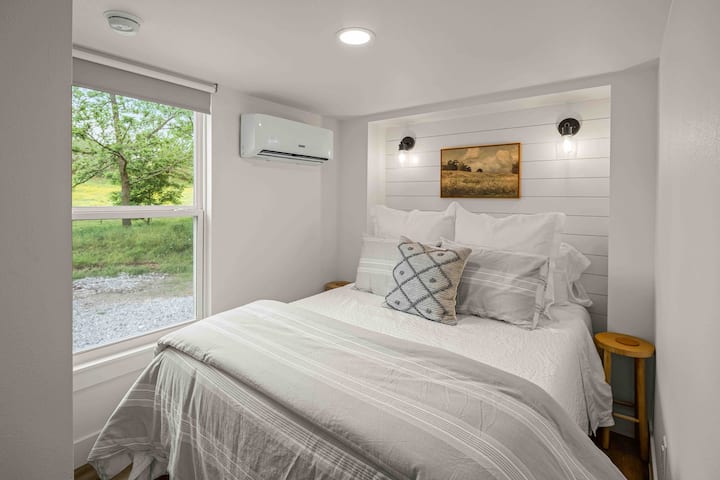 Main bedroom has a queen bed with luxurious bedding and it’s own heat and air unit. 