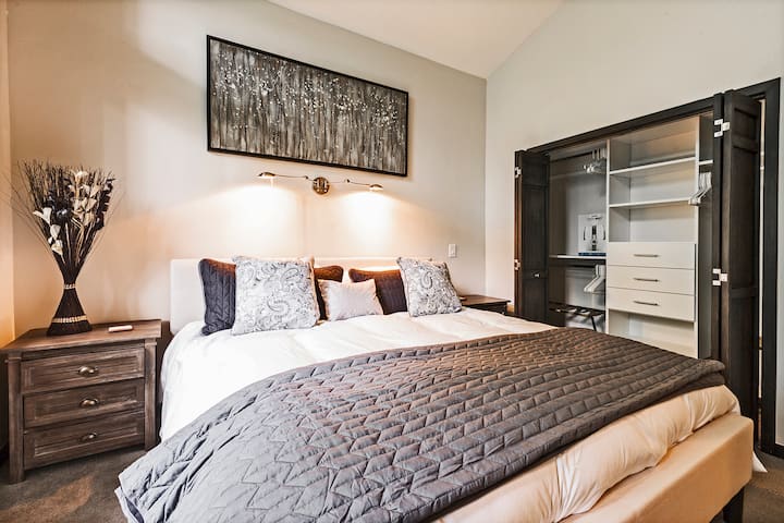 This home has two master bedrooms. The second master is located on the main level of the home and has a king bed and en suite.
