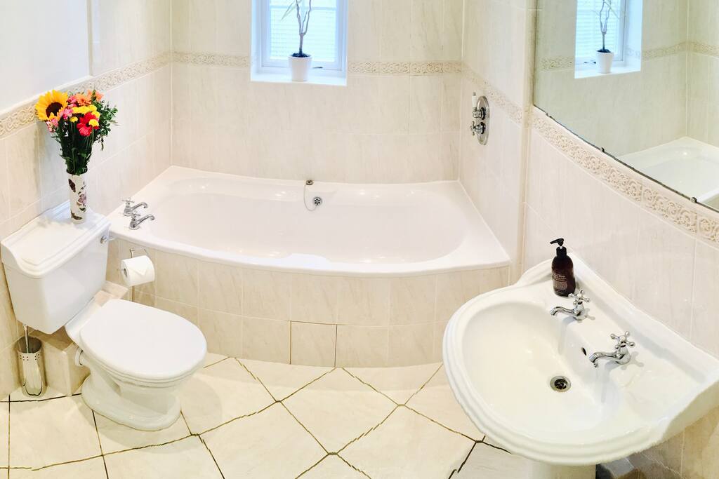 Victorian Style Bathroom with a relaxing beautiful Villeroy & Boch Bathtub. This Bathroom also has a Rain Shower.