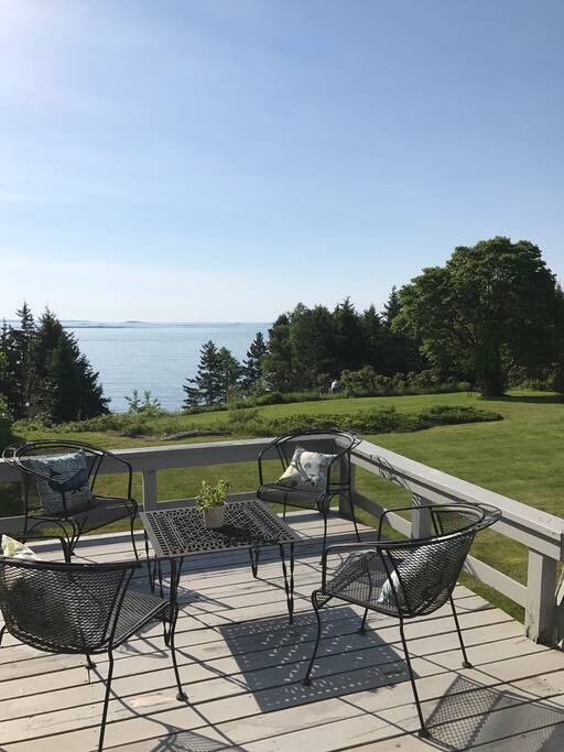On the back porch, overlooking majestic Casco Bay islands. Perfect for sunrises with tea and coffee.