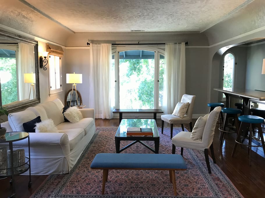 View of the living room from the dining room. Notice the bar in the corner! You get access to this in addition to the bedroom.
