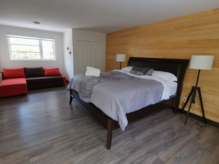 Bedroom 1 features a cozy King size bed and a comfortable sofa bed (bedding provided) 