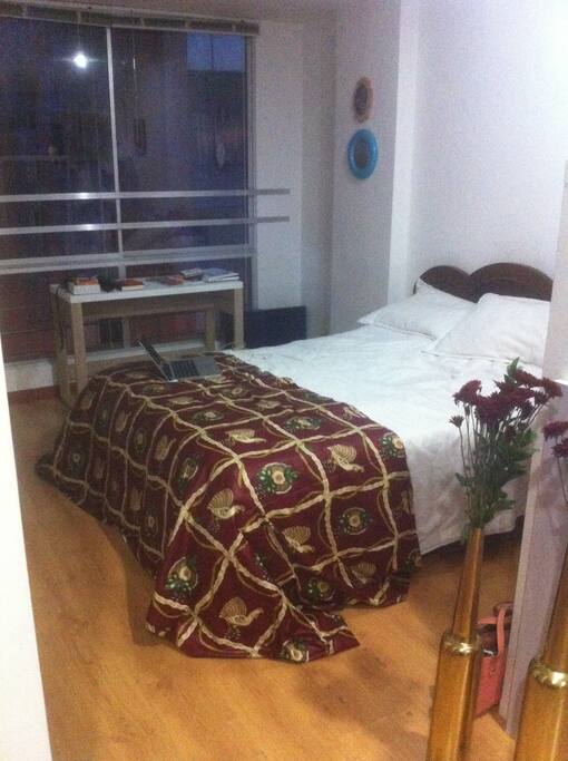 Confortable Double Bed and Desk.