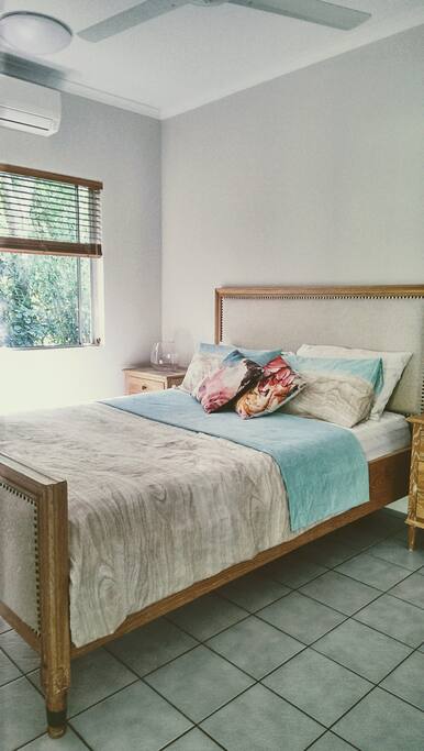 Guest bedroom with a nice view of our bamboo fence