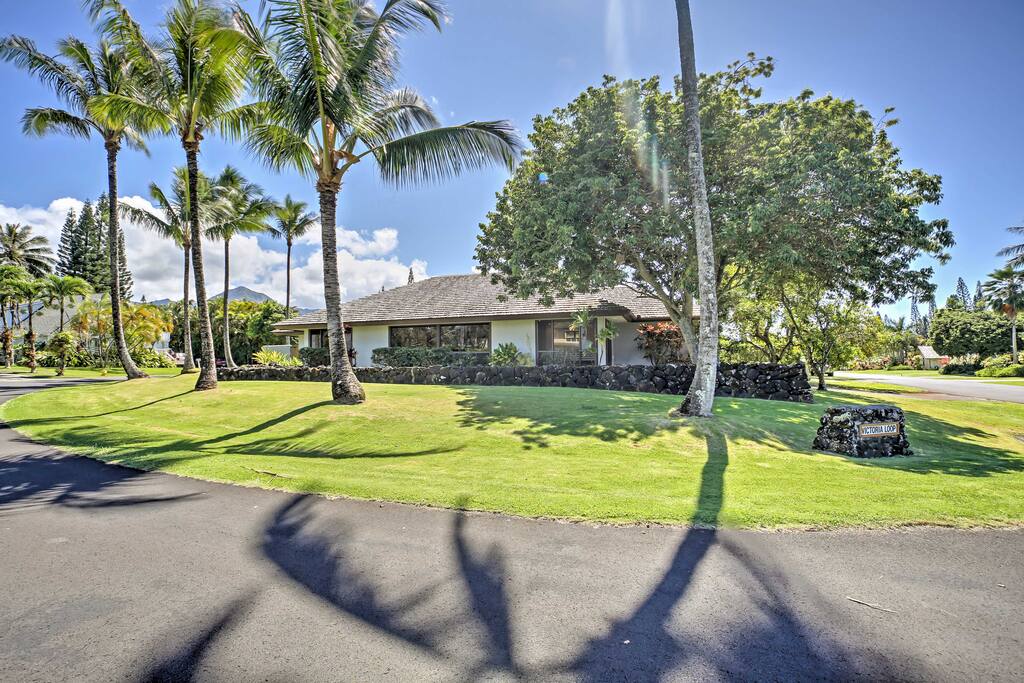 This home is surrounded by mature coconut trees and beautiful lava rock.