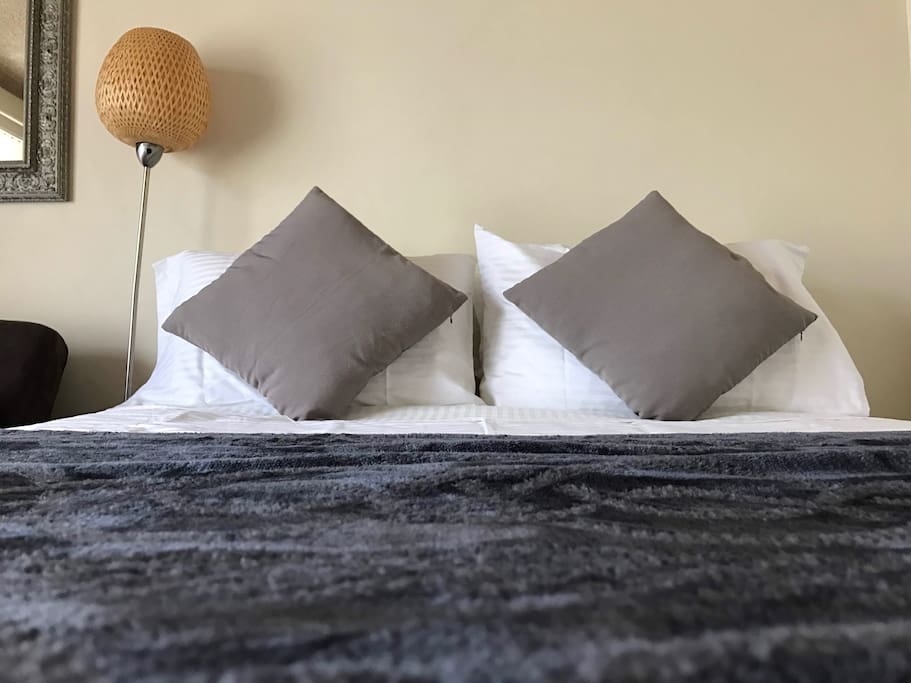 Comfortable Sealy Posturepedic double bed with clean linen