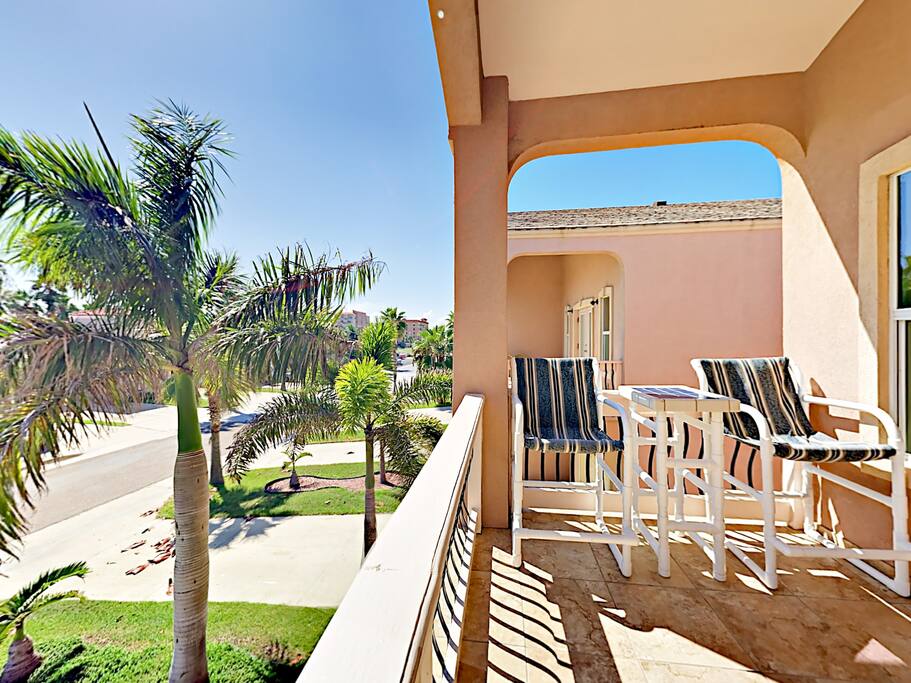 Enjoy tropical views from your balcony. You're just steps from the beach.