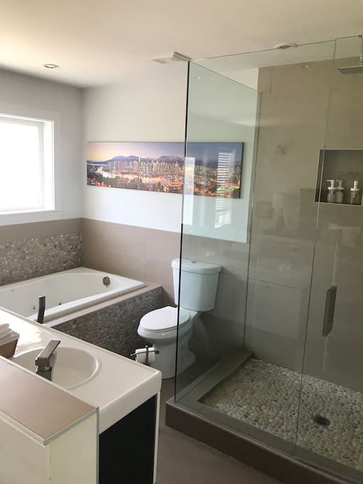 Bright bathroom opening onto the bedroom. Walk in shower and soaker tub.