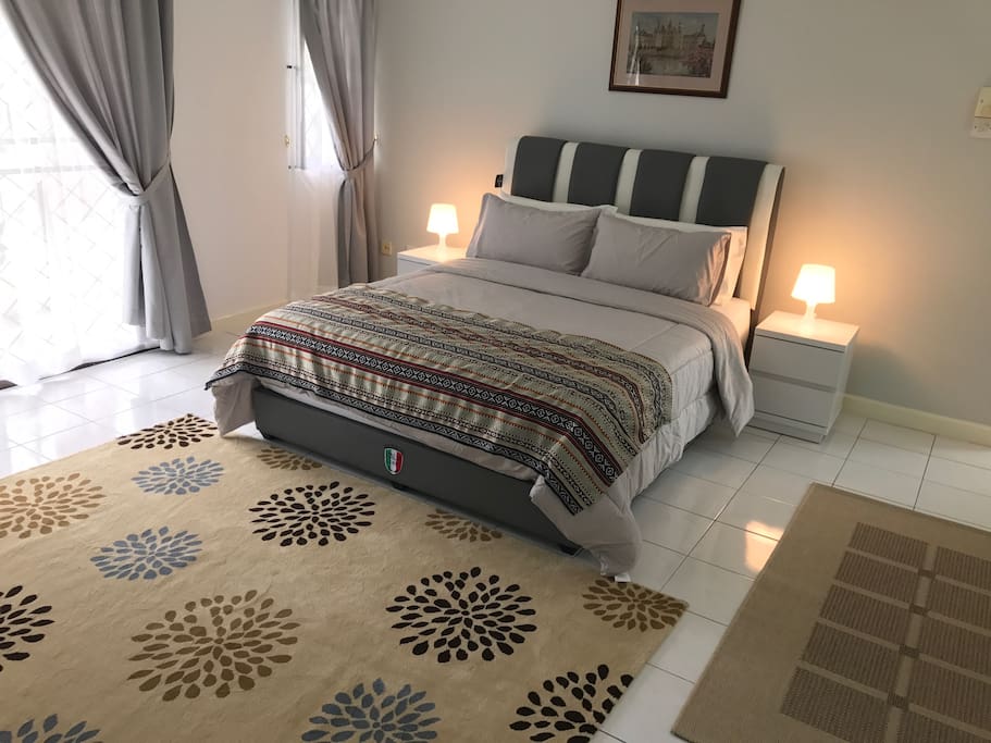 Bedroom A sleeps 2 guests, has private bathroom & shared balcony