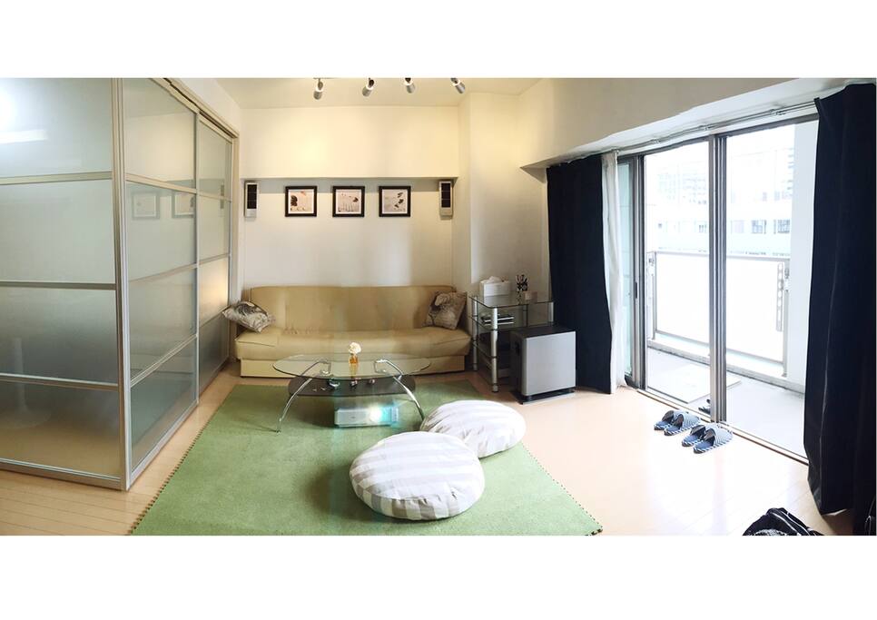 Living area with carpet and balcony